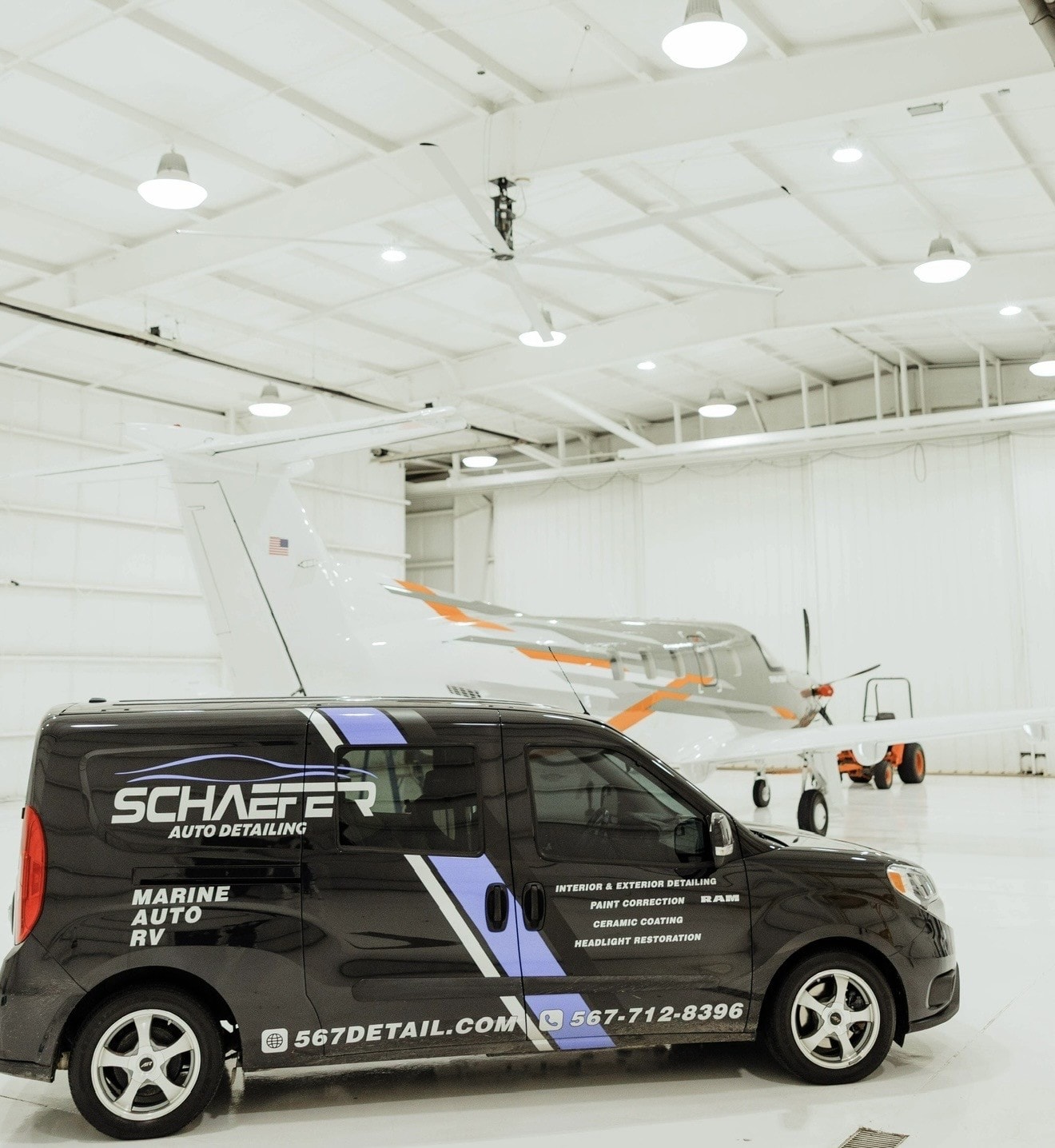 Schaefer Auto Detailing service van in hangar